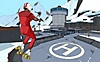 《Rollerdrome》螢幕截圖，顯示主角在空中飛越直升機停機坪上方
