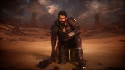 Screenshot Saros-trailer met Arjun op het strand die naast zijn wapen knielt