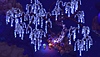 captura de pantalla que muestra a personajes de Sea of Stars bajo un árbol que brilla