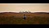 Season: A Letter to the Future captura de pantalla que muestra al protagonista sentado en un campo