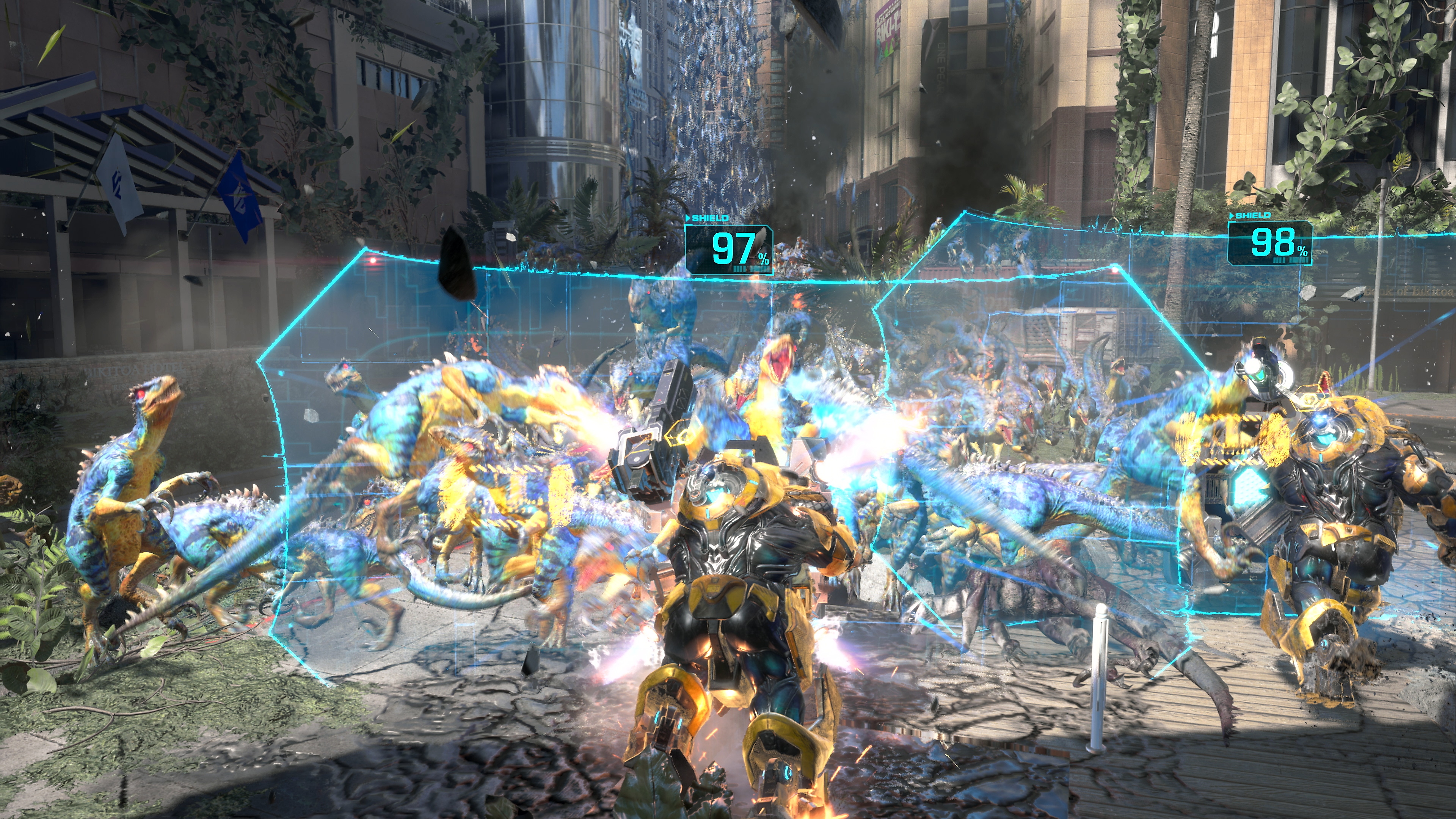 لقطة شاشة للعبة Exoprimal يظهر فيها حشد من الديناصورات يركض نحو حواجز درع شفافة زرقاء