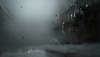 Silent Hill 2 – Screenshot, der eine verlassene, nebelverhangene Straße zeigt.