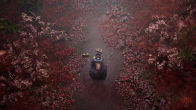Silent Hill f – Screenshot von Shimizu Hinako, die verletzt in einem Feld aus roten Blumen kauert. 