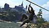 Screenshot van Sniper Elite 5 met daarop een personage dat een zipline gebruikt