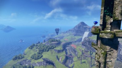Sonic Frontiers screenshot showing Sonic standing atop an ancient tower overlooking one of the islands