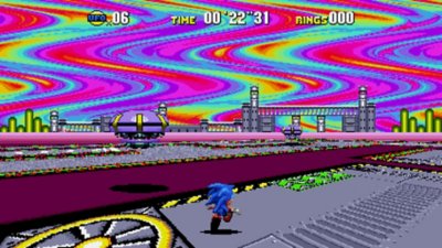 Sonic Origins – Screenshot, der Sonic zeigt, wie er durch ein Level mit einem regenbogenfarbenen Himmel rennt.