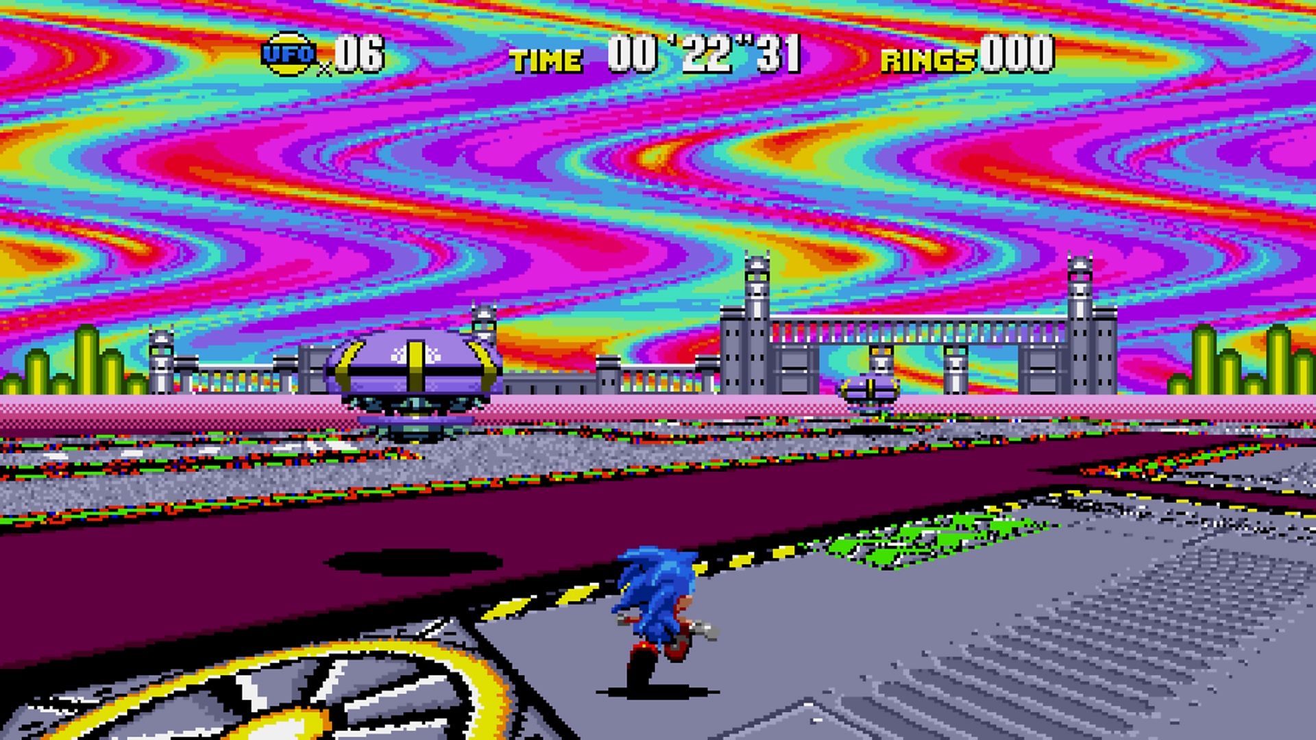Capture d'écran de Sonic Origins montrant Sonic courant dans un niveau avec un ciel couleur arc-en-ciel