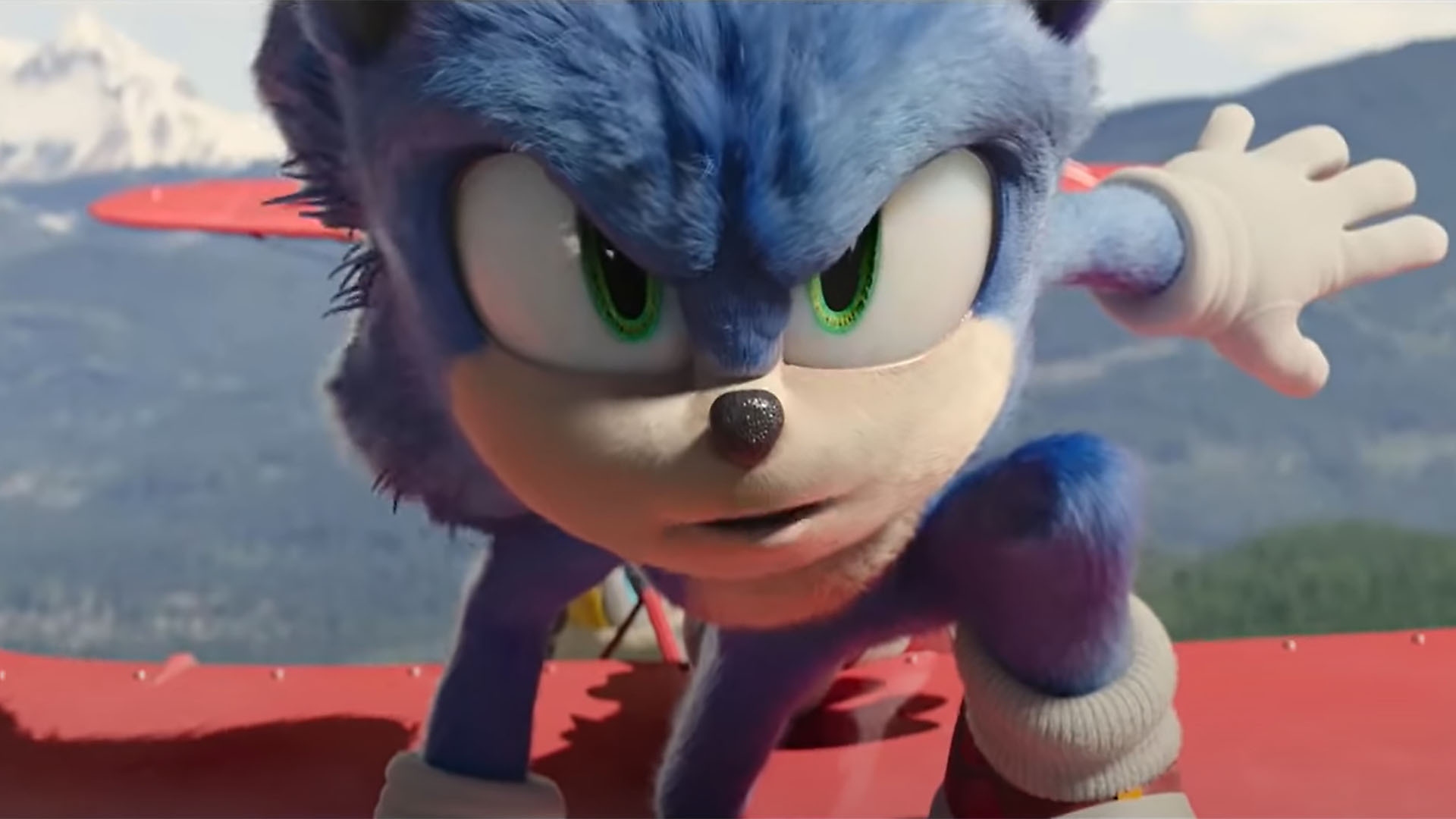 Sonic the Hedgehog crouches down on top of a red helicopter