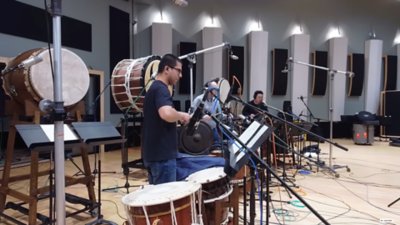 Japanese traditional orchestra performing the soundtrack of Ghost of Yōtei on stage.