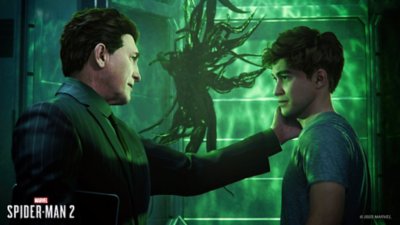 Norman and Harry Osborn stand in a lab with the Venom symbiote floating in a tank in the background.