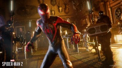 Miles stands in a hunter’s trophy room surrounded by enemies.