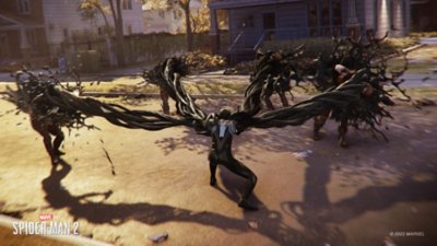 Peter Parker fights multiple enemies at once using the symbiote’s powers.