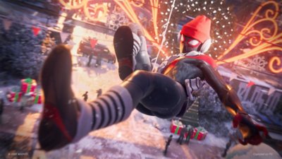 marvel's spider-man miles morales pc screenshot showing Miles kicking through the air wearing ear warmers