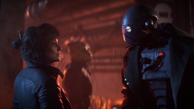 Captura de pantalla de Star Wars Outlaws que muestra a Kay sosteniendo un droide.