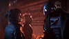 Star Wars Outlaws – zrzut ekranu przedstawiający Kay rozmawiającą z droidem.