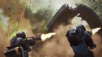 Starship Troopers: Extermination screenshot showing two soldiers firing at a large enemy