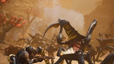 Starship Troopers: Extermination – Screenshot, auf dem Soldaten einen Bug umzingeln