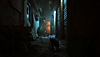 Stray screenshot showing a cat walking down an alley