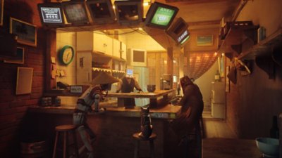 Captura de pantalla de Stray que muestra a un gato sentado en un bar con dos robots