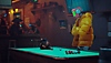 《Stray》螢幕截圖，展示一隻貓坐在機器人旁邊的撞球桌上
