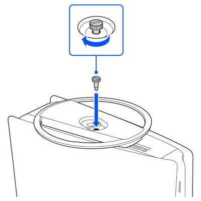 Image montrant le socle placé contre le dessous de la console avec les trous de vis alignés.