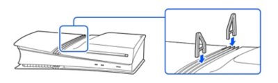 Side view of the PS5 console with a disc drive installed. Inset shows the feet (long) being inserted above the disc drive.