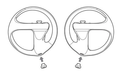 Attaching charging adaptors to PSVR2 Sense controllers.