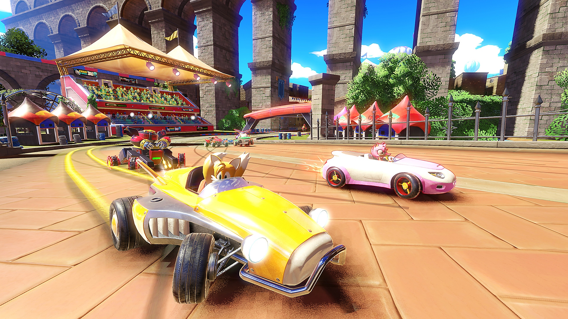 Screenshot van Team Sonic Racing met daarop Tails in een gele auto