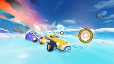 Snimka zaslona iz igre Team Sonic Racing prikazuje Tailsa u žutom automobilu na ledenoj stazi