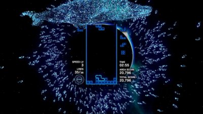 Tetris Effect Connected 스크린샷, 네온 물고기와 고래로 가득한 모래톱을 배경으로 게임 플레이 중