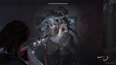The Last of Us Part II Remastered - No Return screenshot showing a modded gun being aimed at a grotesque enemy