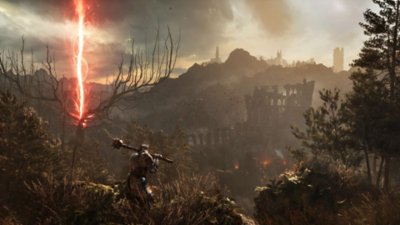 Lords of the Fallen – skärmbild på en vapendragare vänd mot ett förstört landskap med en röd stråle i fjärran