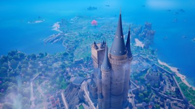 The Seven Deadly Sins: Origin screenshot showing a castle with a tower looming over the rest of the town