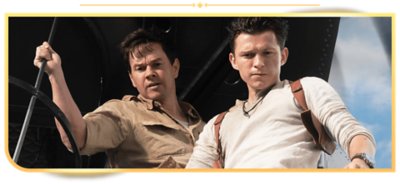Tom Holland as Nathan Drake and Mark Wahlberg as Victor Sullivan stand in a helicopter in Uncharted