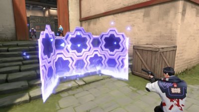 Valorant screenshot showing a character taking aim from behind a glowing purple defensive screen