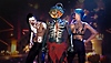 Vampire: The Masquerade Bloodhunt στιγμιότυπο με τρεις χαρακτήρες να φορούν διακοσμητικά αντικείμενα με θέμα το Halloween