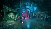 لقطة شاشة من لعبة Wayfinder تظهر زقاقًا مظلمًا مضاءً بلافتات من النيون الأزرق