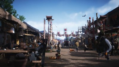 Captura de pantalla de Where Winds Meet que muestra un bullicioso pueblo.