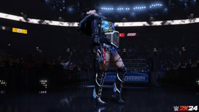 Captura de tela de WWE 2K24 mostrando a superestrela Iyo Sky usando um cinturão de campeonato no ringue